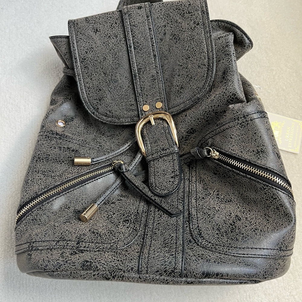 NWT- Vegan leather knapsack in charcoal grey. Grey/white stripes interior